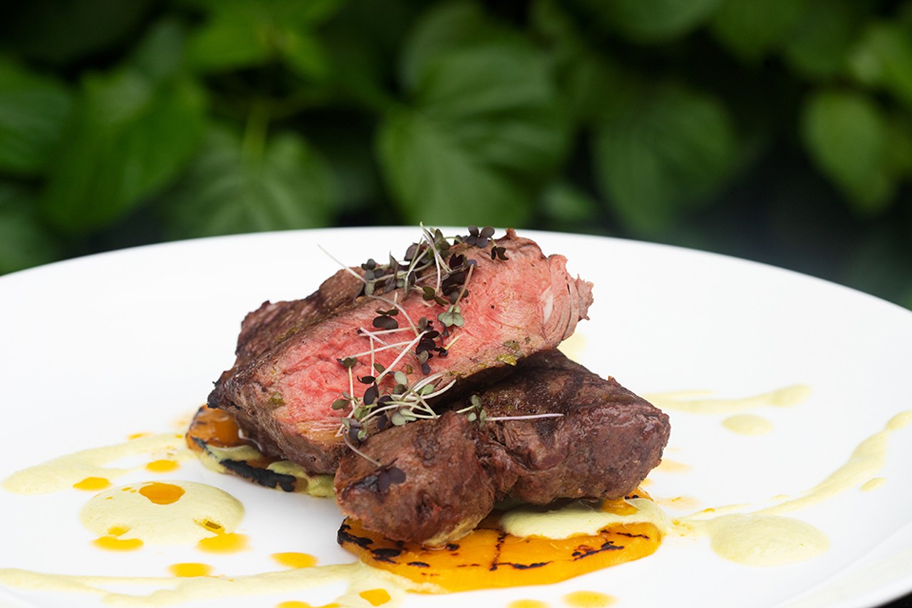 King cut sirloin with asparagus-truffle puree, gold beets and smoked rosemary gremolata.
