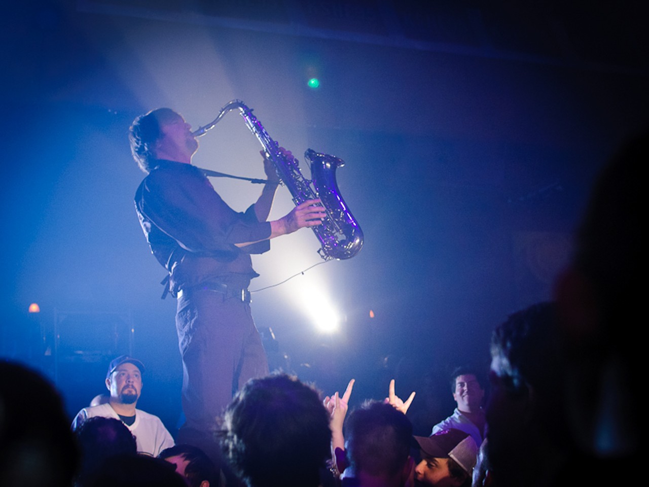 Saxophonist David Farver joined the rest of the band onstage, but not until he'd walked along the tabletops through the crowd.