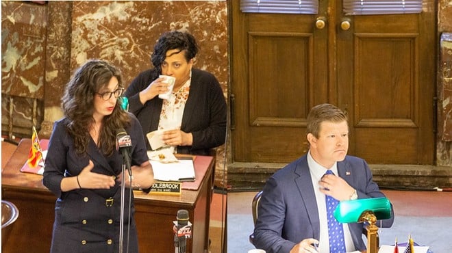 Megan Green (left, at microphone) and Jack Coatar at a Board of Aldermen meeting in 2019.