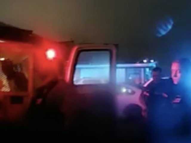 Body cam shows Allen Robinson being put in the back of a police van.