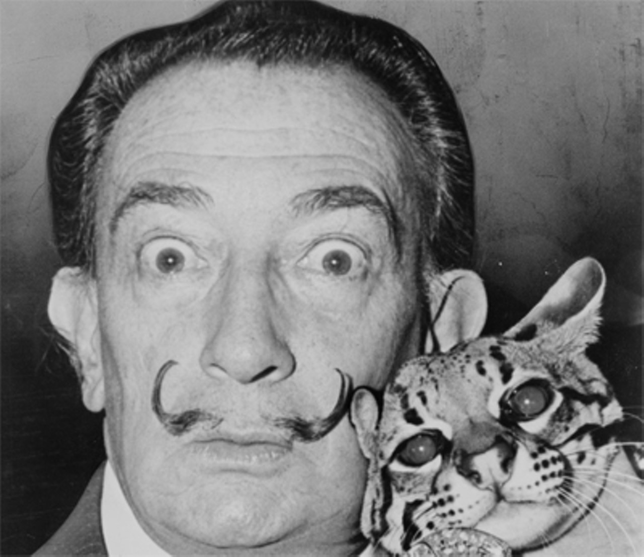 Another surrealist painter, another mustache. Salvador Dali (1904-1989), best known for striking and bizarre images in his paintings. Also known for a handlebar mustache.