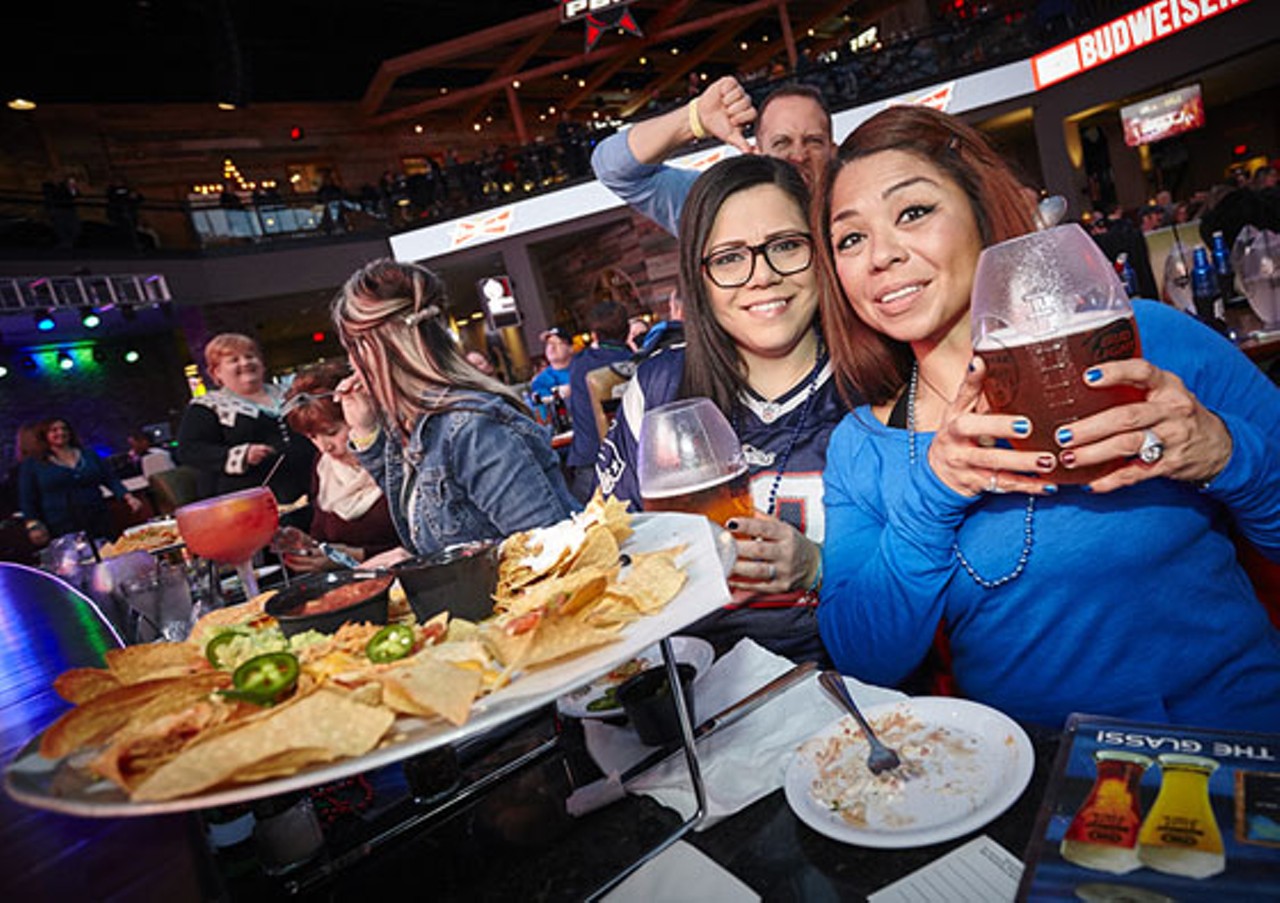 Lucy Rios and Marisol Lopez indulge in the football classic "Beer and Nachos."