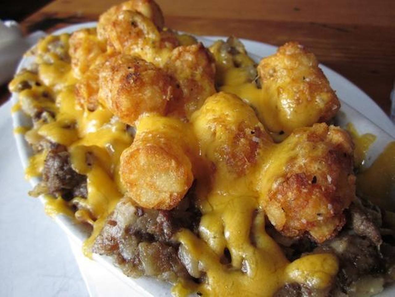 Say goodbye to your hangover and hello to the tater tot casserole, featuring baked beef and cheddar at Zayda Buddy's Pizza in Seattle, Washington.