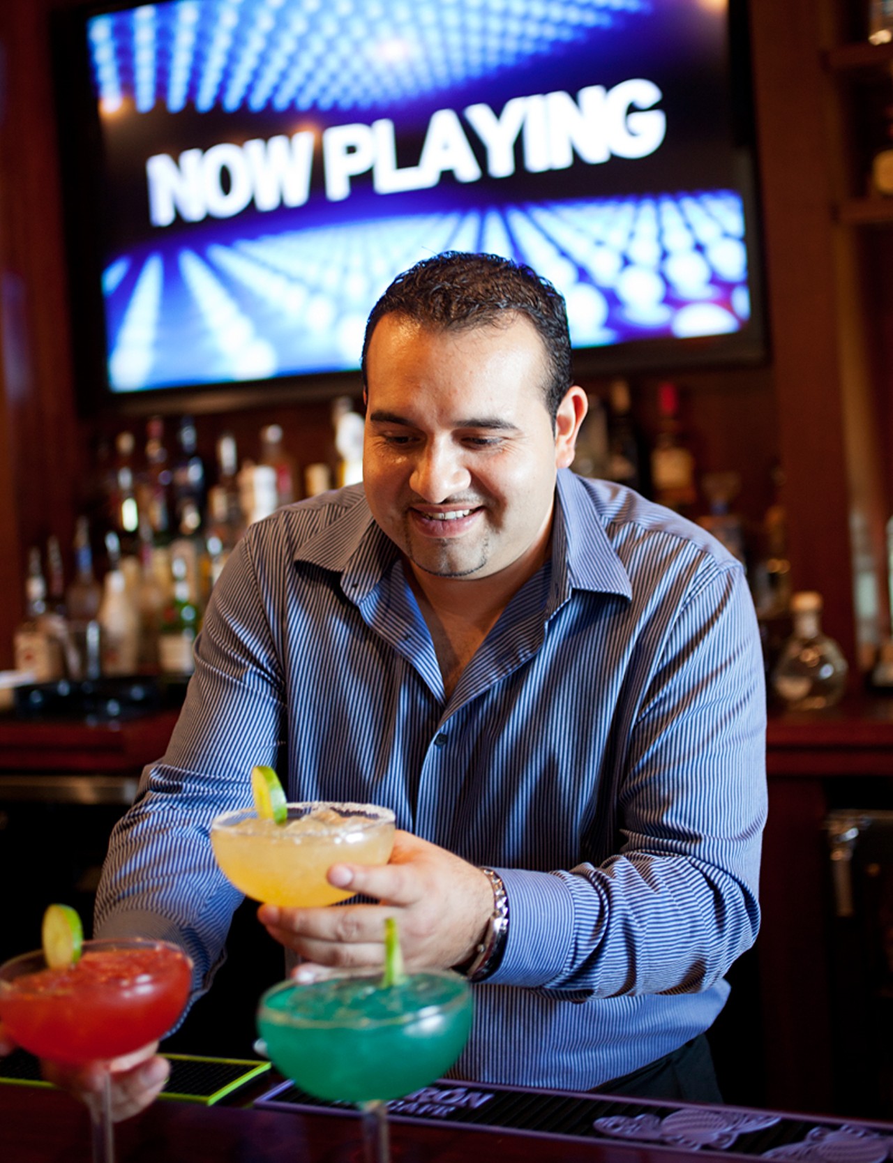 Roger A. Aguirre -- the GM, a co-owner and a chef -- makes margaritas.