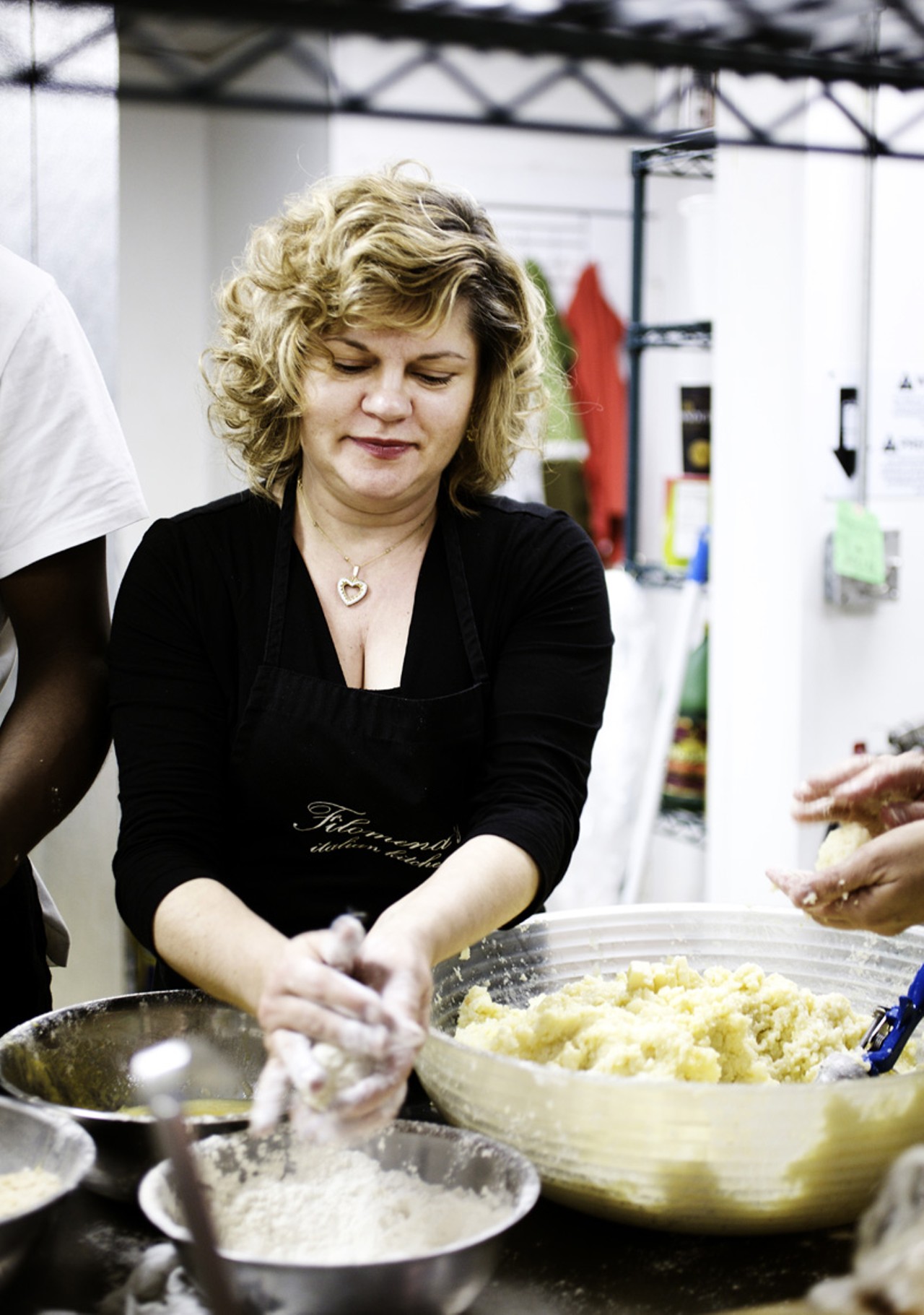Filomena Dean, one of the four owner's of Filomena's, in the kitchen preparing the arancini.