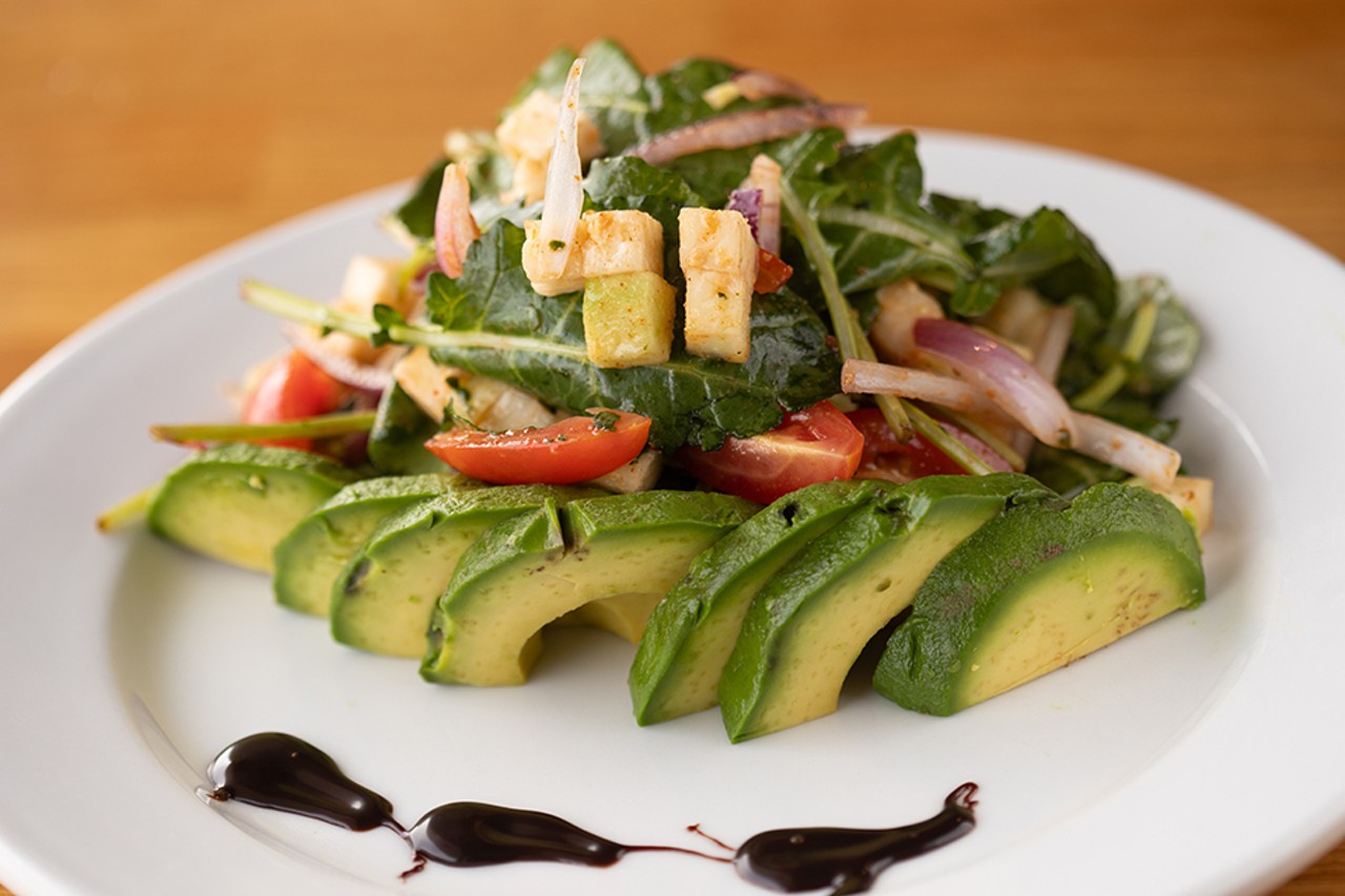Kale, guava and avocado salad with onion and tomato, tossed in Black Salt's special guava dressing.
