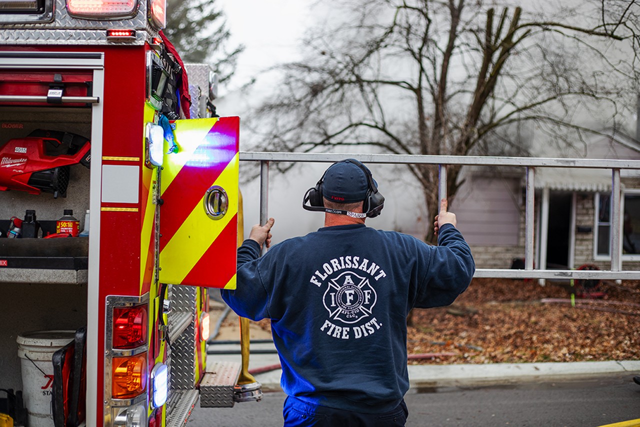 A firefighter with the Florissant Valley Fire Protection District retrieves a ladder on Friday, Jan. 26, 2024, in Florissant.