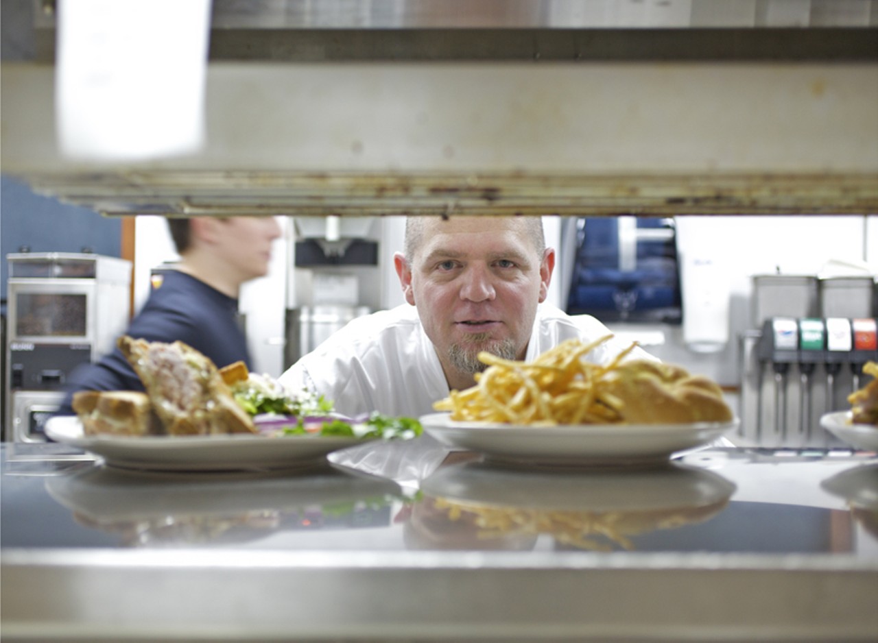 Chef restaurateur Jeff Constance overseeing the lunch items as they make their way out to the floor.