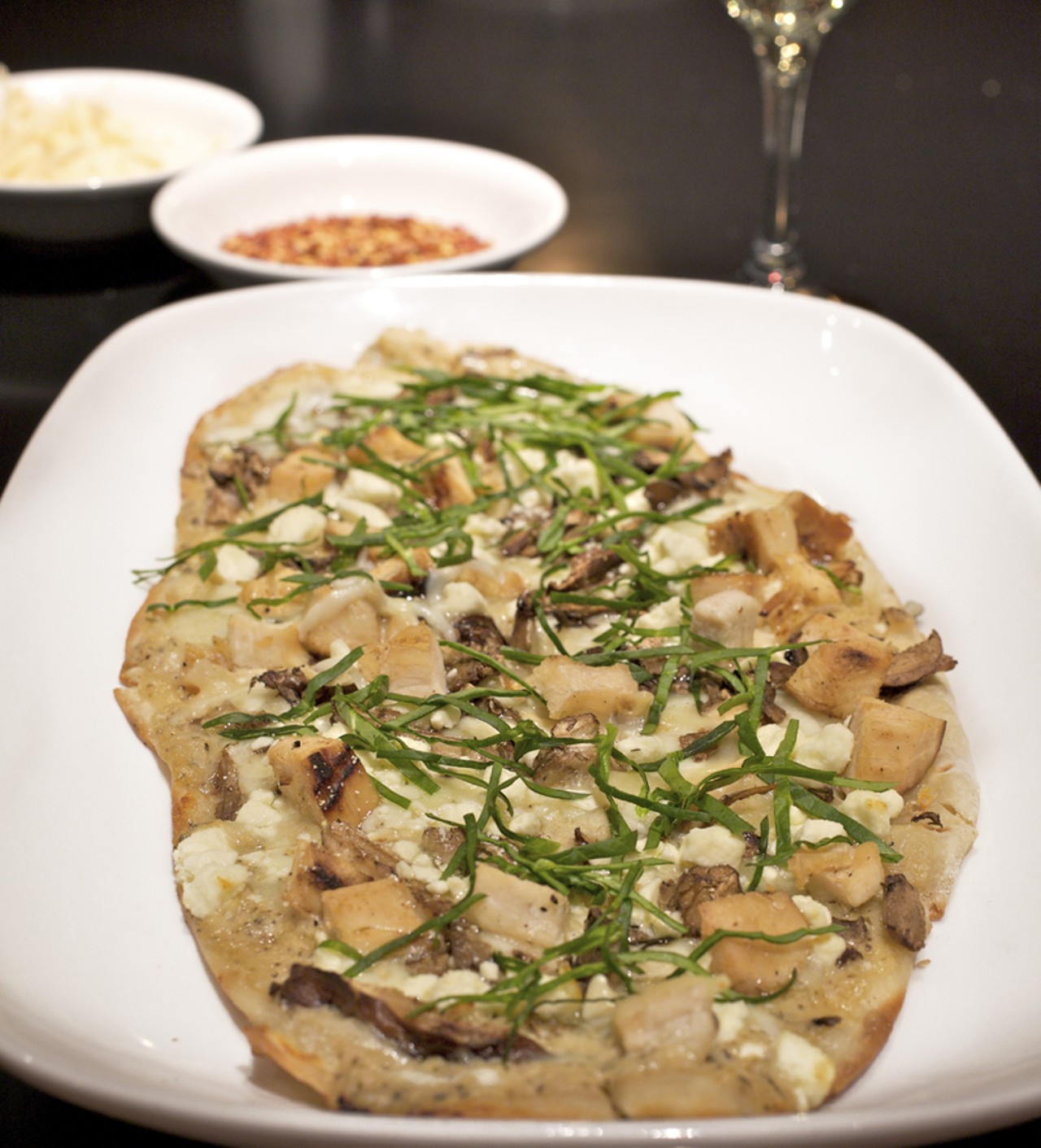 One of four flatbreads on the menu, the White chicken flatbread is served with grilled rosemary chicken, wild mushrooms, spinach and Feta cheese.