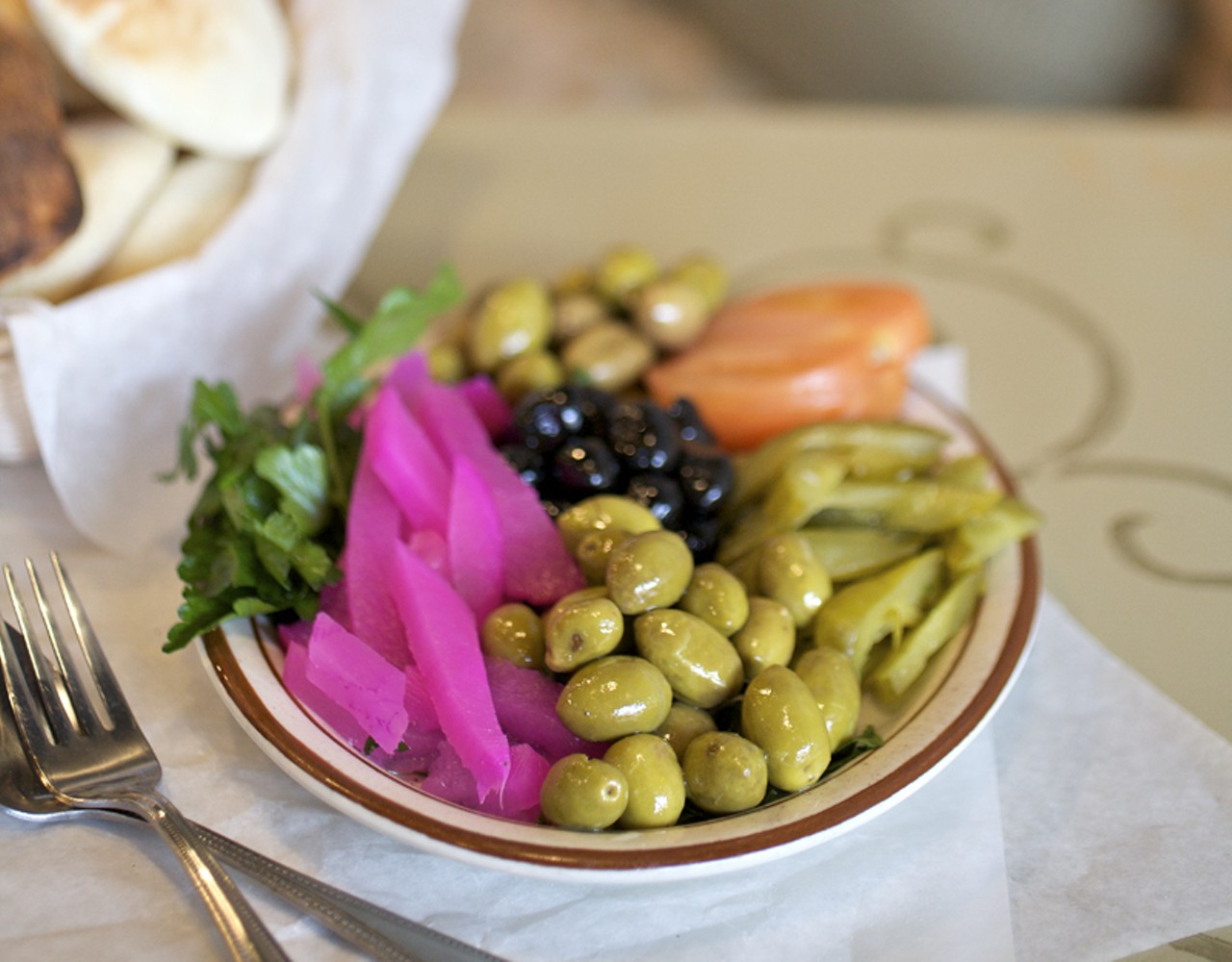 The pickle plate comes with the combo appetizer. The bright pink vegetable is a pickled turnip. The plate also comes with green olives pickled with lemon, calamata olives in olive oil, pickled Persian cucumbers, tomato and flat leaf parsley.