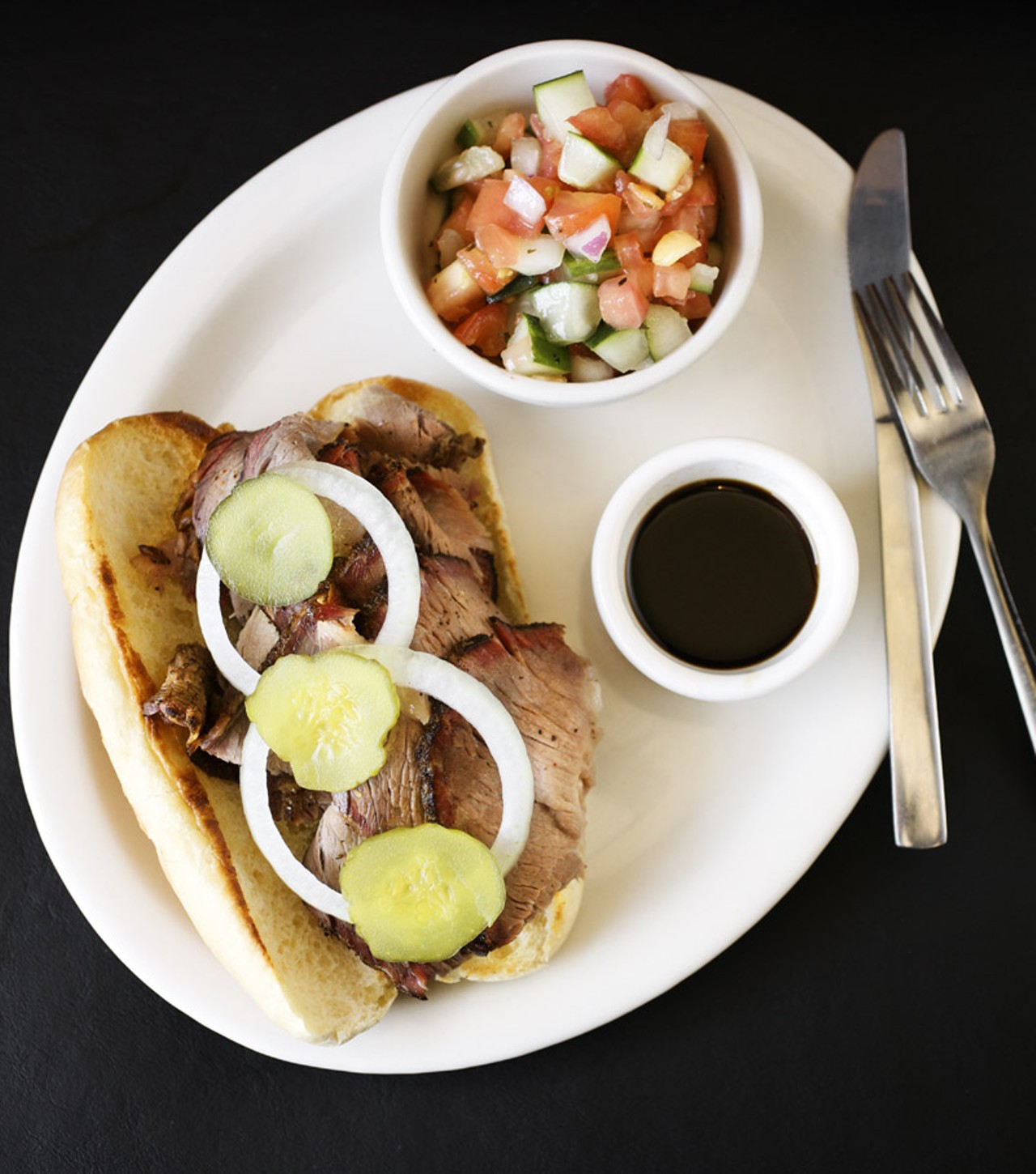 The beef brisket Sandwich at Flavors BBQ is made with marinated brisket, which is smoked and thinly sliced, shown here on the bread choice of a hoagie.
