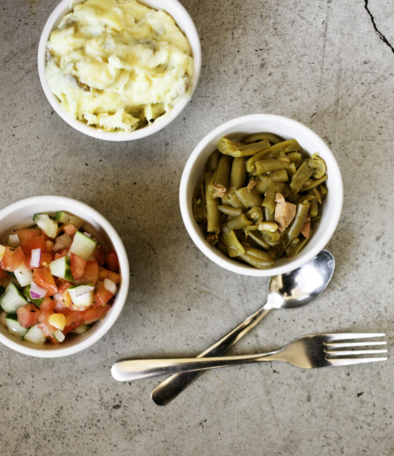 Three sides - potato salad, green beans with smoked turkey and cucumber and tomato salad.