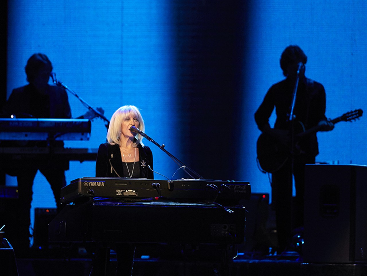 Christine McVie and the two touring musicians.