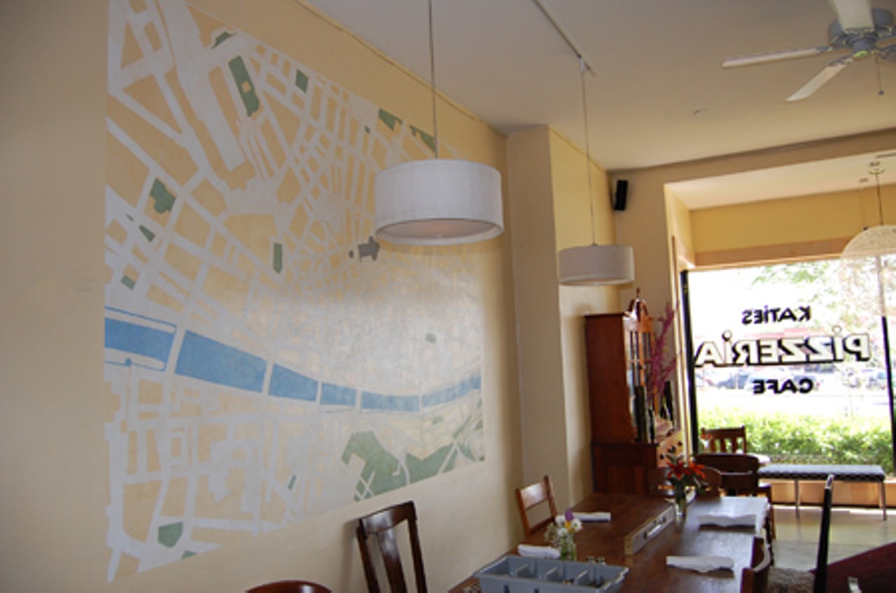 The building used to house a coffee shop, but has underwent aesthetic changes, including this street map of Florence, Italy, to its interior.