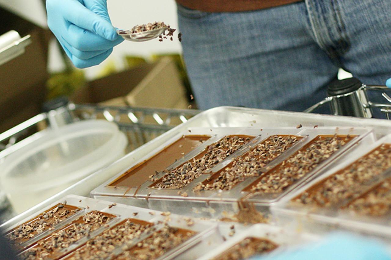 This batch of chocolate bars receives spoonfuls of 100-percent Madagascar nib topping.