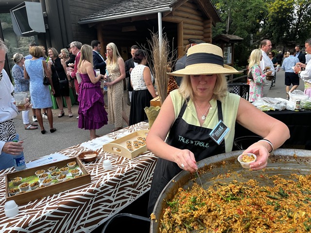 Kate Hannan of Tale to Table serves up some paella from a very giant pan.