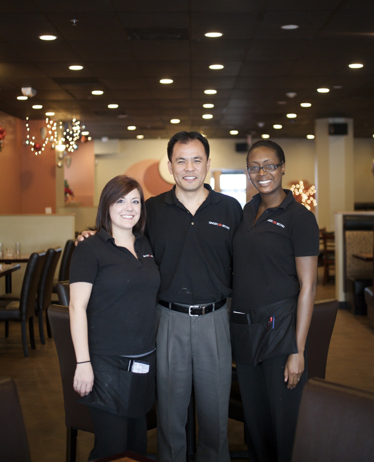 One of the owners, John Huang, with servers Stephanie Martin (on left) and Lauren Hollins (on right).