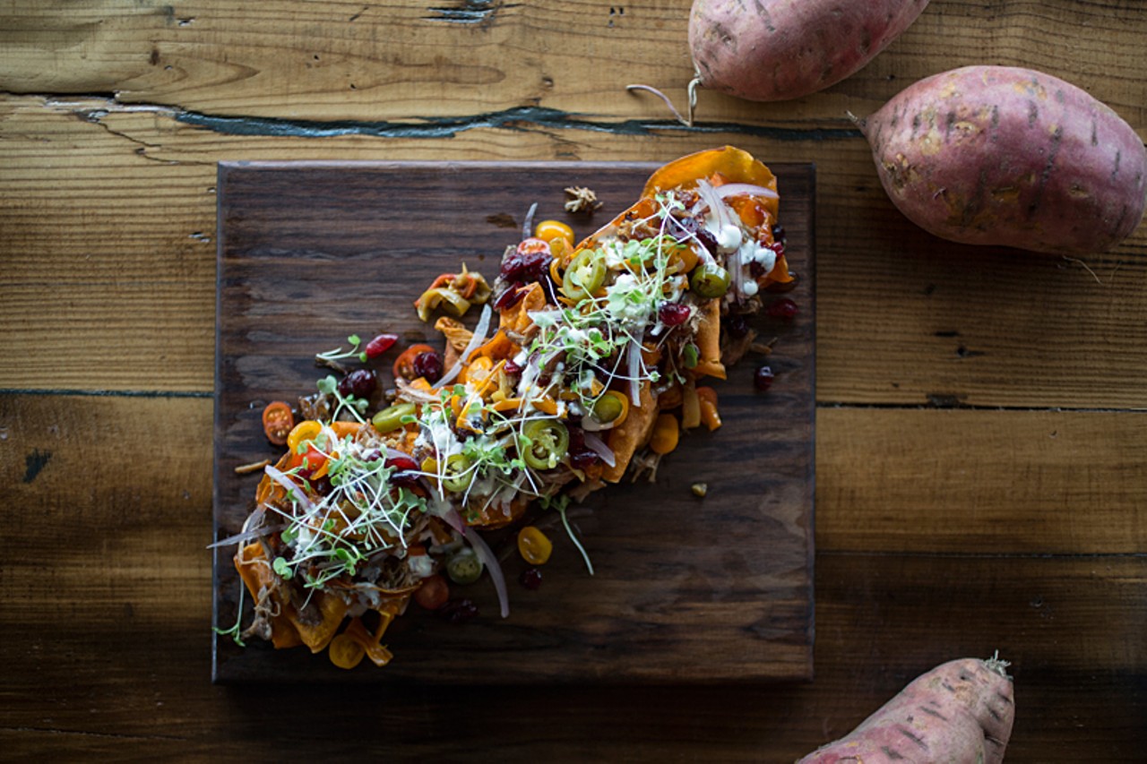 Grapeseed's nachos are sweet-potato chips topped with Buttonwood Farms smoked pulled turkey, cranberry firecracker sauce, tomatoes, onion, peppers, house buttermilk dressing and local microgreens.