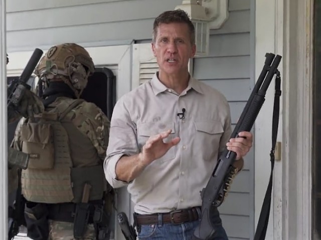 Eric Greitens and a paramilitary goon squad prepare to break into an empty house for some reason.