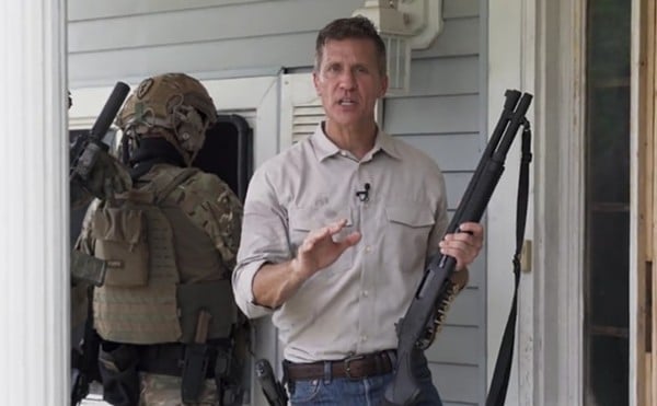 Eric Greitens and a paramilitary goon squad prepare to break into an empty house in Greitens memorable 2022 campaign ad.