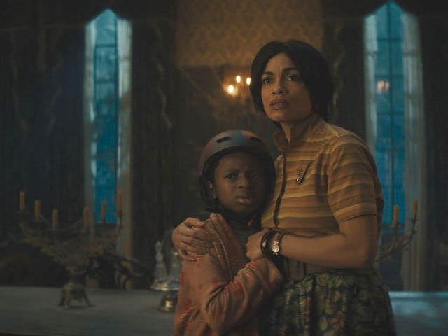Chase Dillon, left, and Rosario Dawson find themselves in Disney's live-action Haunted Mansion.