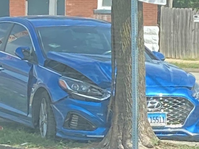 A Hyundai Sonata sits abandoned after being crashed into a tree in St. Louis City.