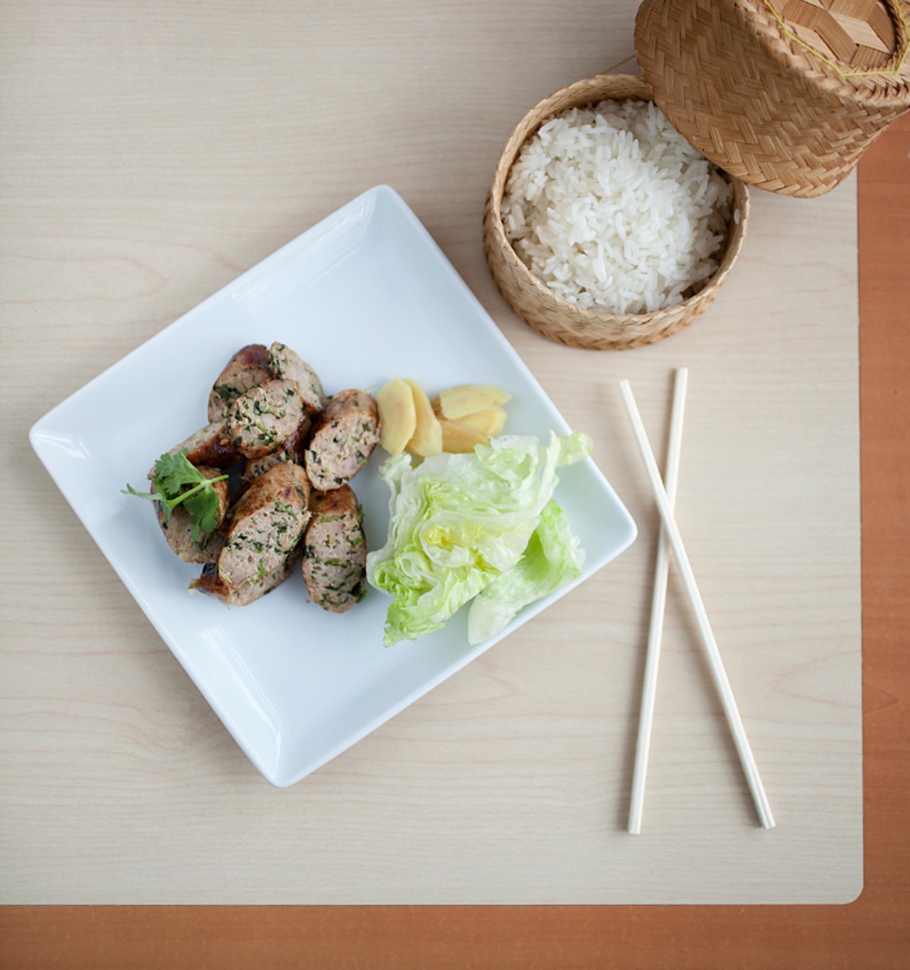 The Sai Oua, from the appetizer menu, is grilled Chiang Mai pork sausage with Thai herbs and is served with sticky rice.
