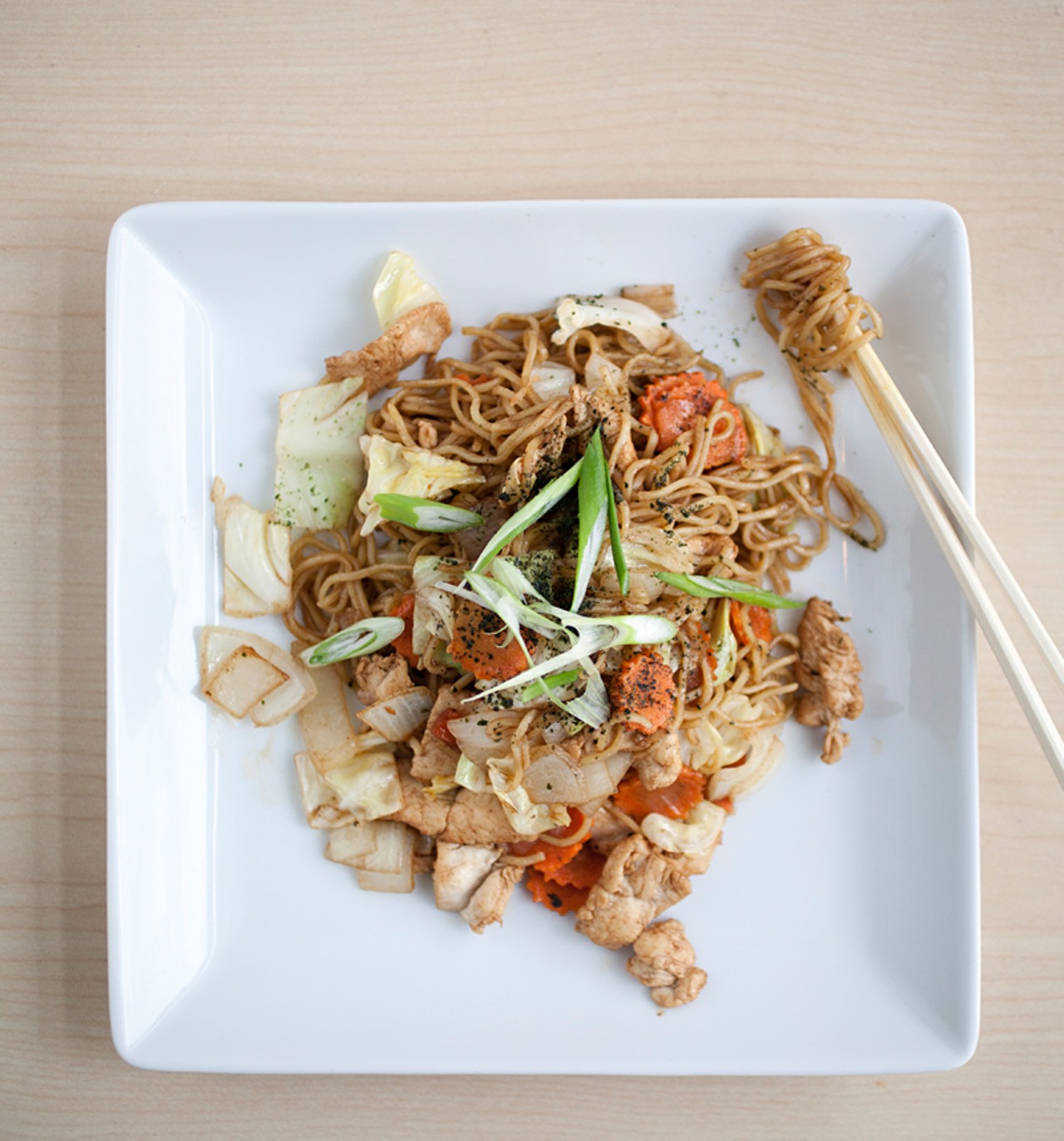 Yakisoba with chicken (you can also choose pork, shrimp, beef or vegetarian versions). This stir fry dish is Japanese egg noodles with cabbage, carrots and onions in Yakisoba sauce.