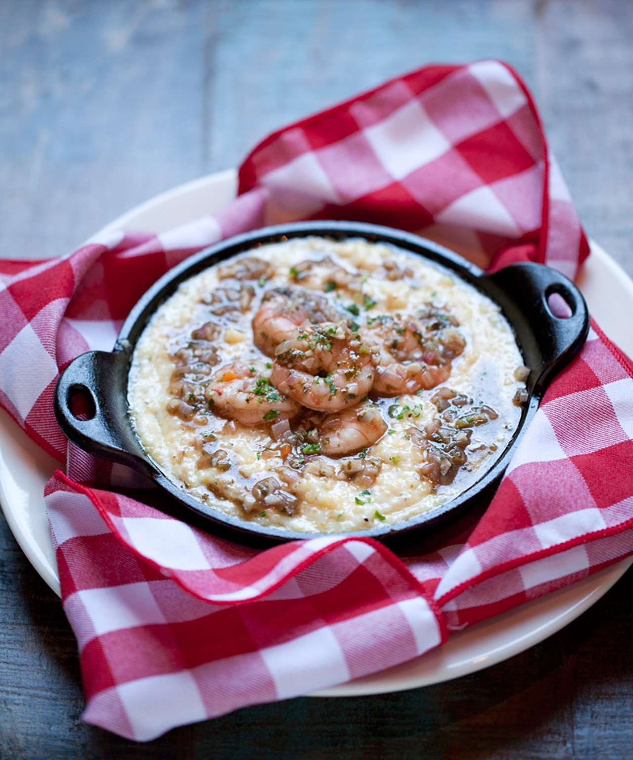 The shrimp and grits are served with Louisiana-style barbecue shrimp and Tillamook cheddar stone-ground grits.