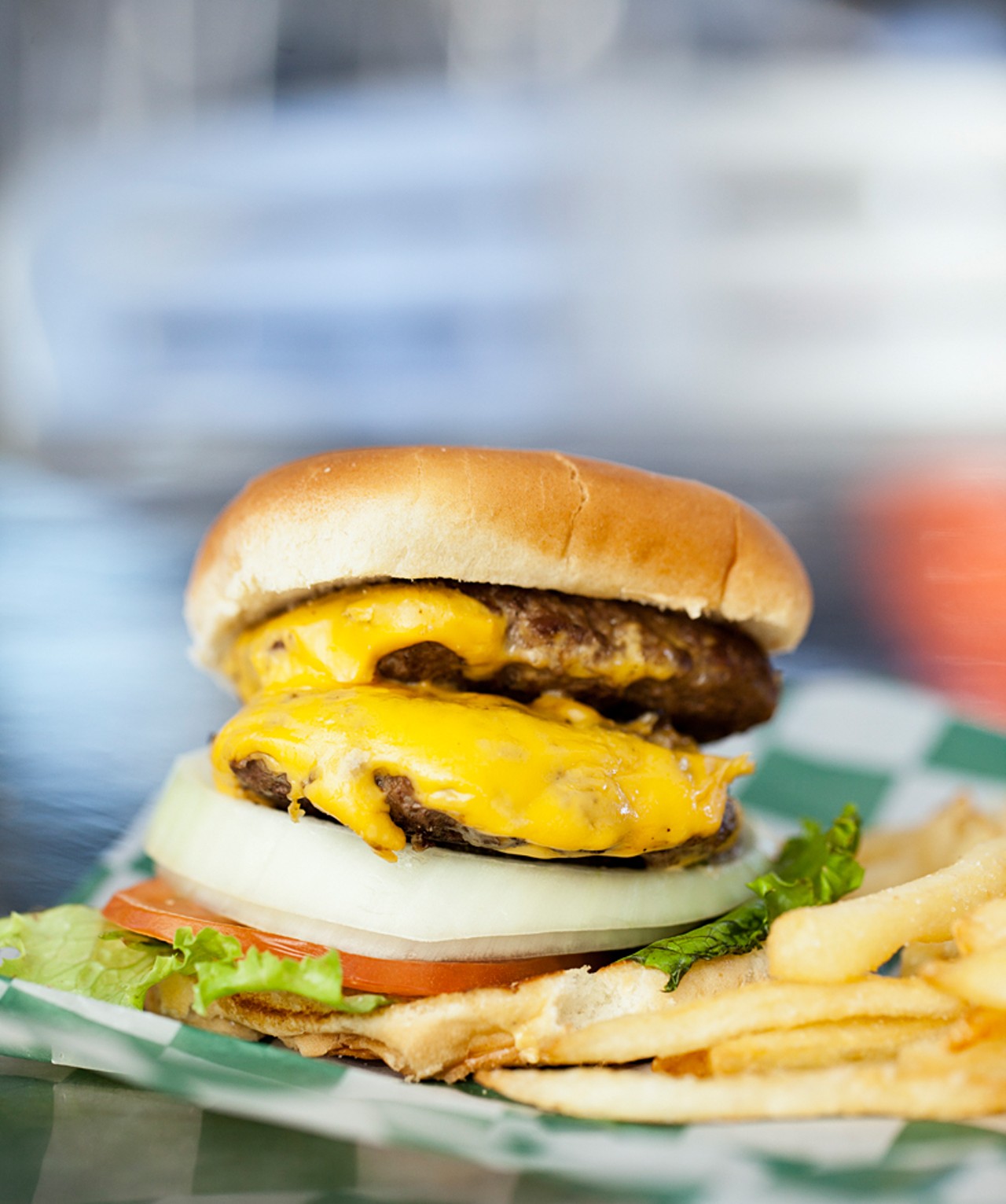 Joe's "Super Double Cheeseburger" comes stacked with double cheese, double burger, onions, lettuce and tomato.