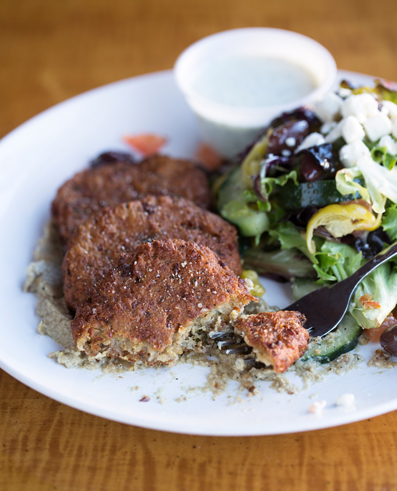 Joyia's falafel is 
served with baba ganoush, cucumbers, red onions, tomatoes, pepperoncini, feta cheese and tzatziki.