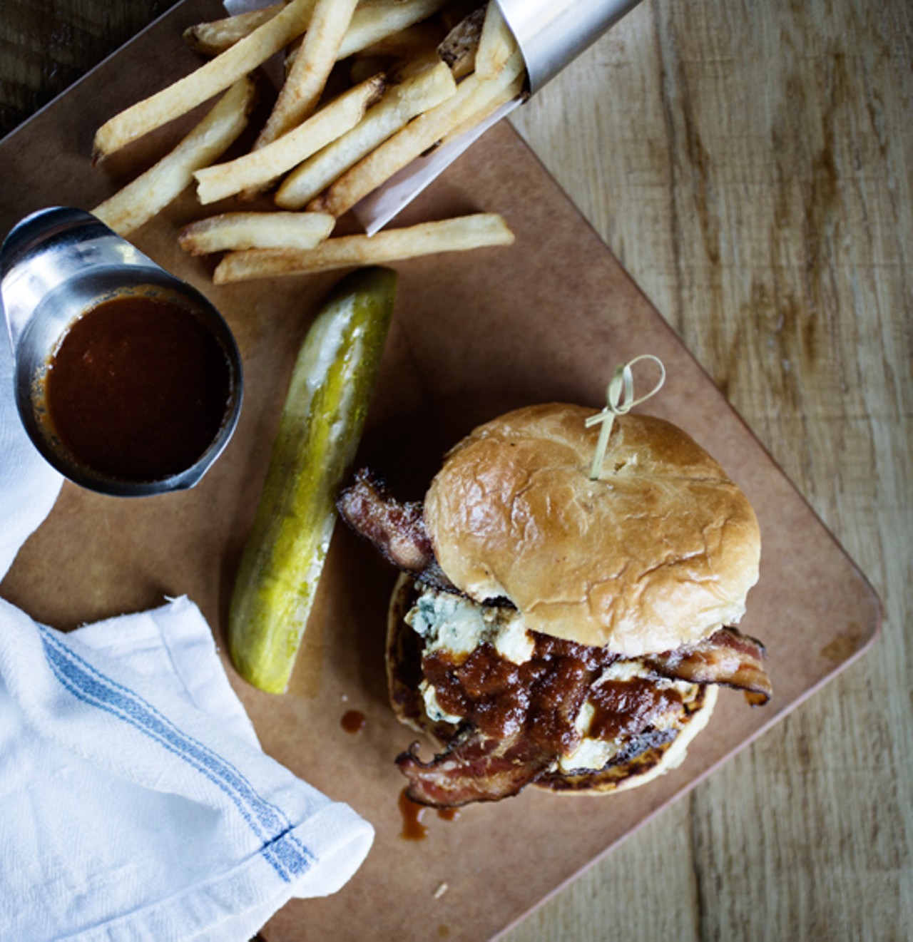 The "BBBB" is barbecued burger made of a blend of bison, blue cheese and bacon on a brioche bun.