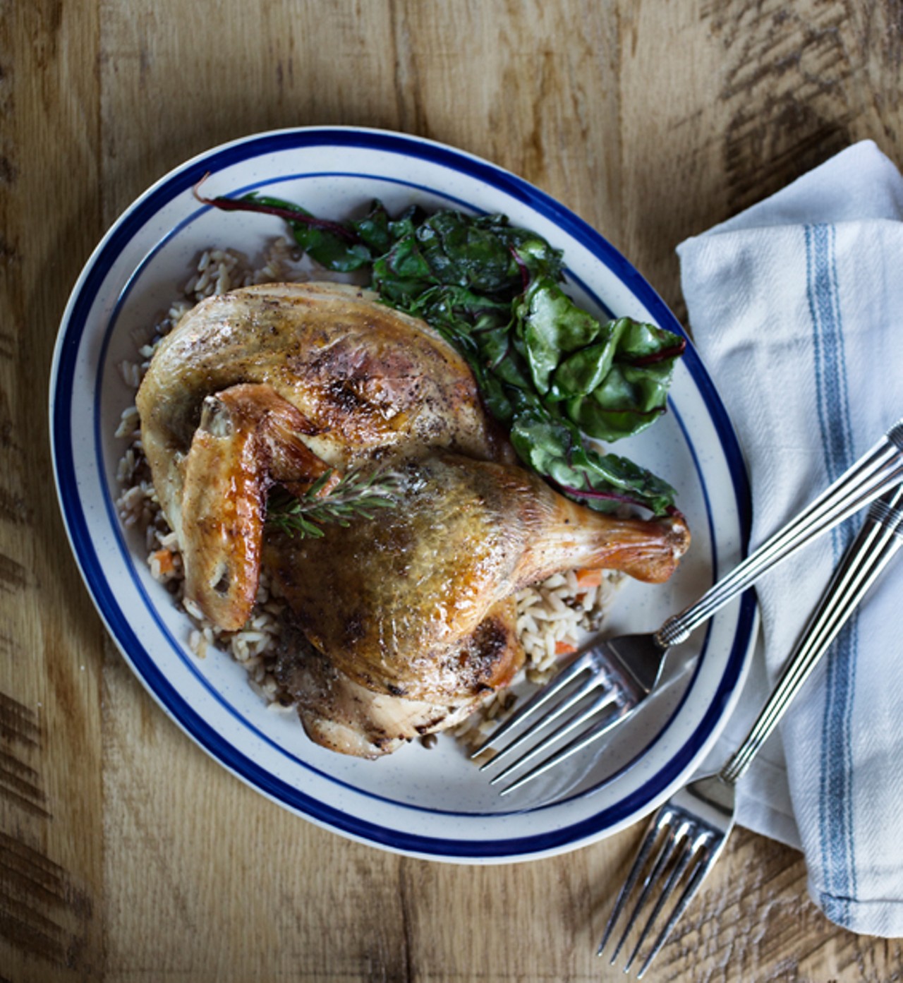 The roast chicken is Amish chicken infused with wild mushroom and truffle, French lentil and rice.