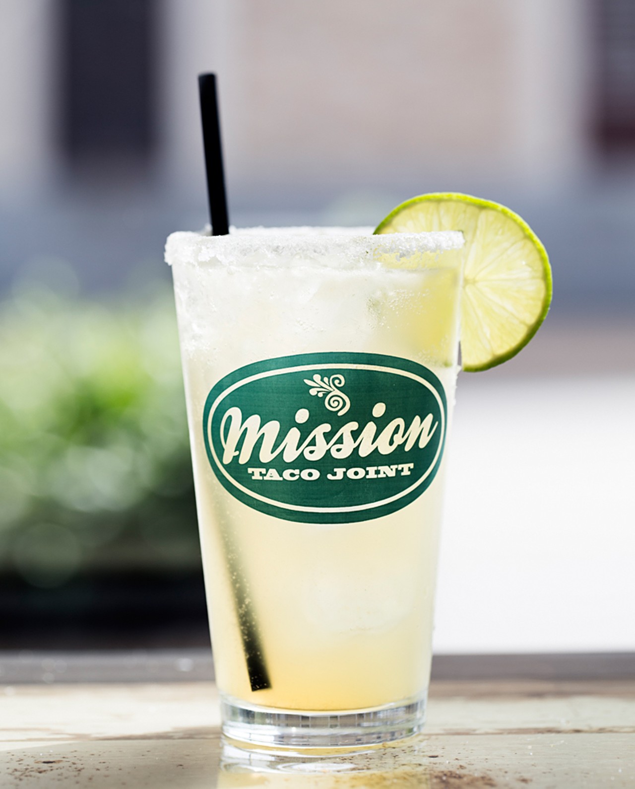 The Mission Margarita is made with blanco tequila, orange curacao and housemade lime-orange agua fresca. It's hand shaken and served in a salt-rimmed pint glass.