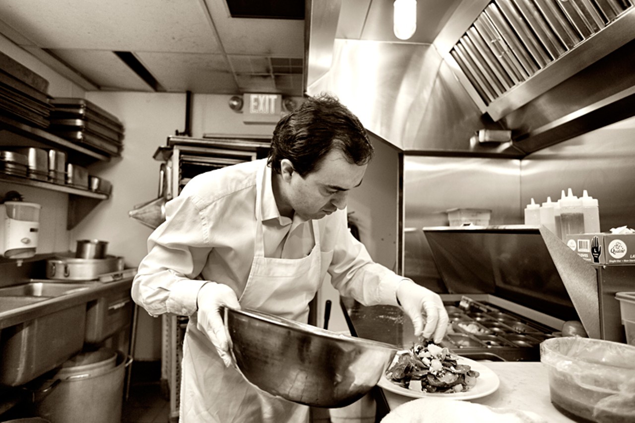 Owner and Executive Chef Sam Kacar preparing a salad.