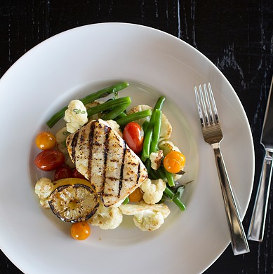 Off the dinner menu: Wood-grilled halibut with green beans, cauliflower, lemon, oregano, tomato and olive oil.