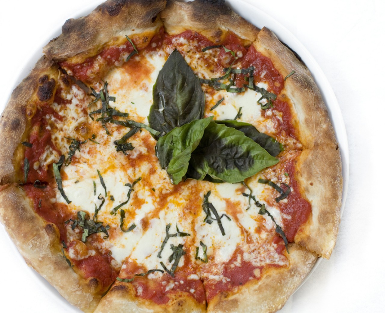 The Margherita pizza. It is a rustic pizza made with Roma tomatoes, fresh mozzarella, fresh basil and Parmesan cheese.