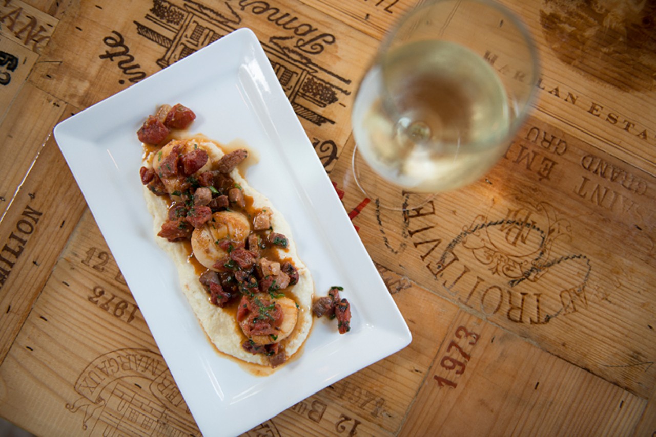 Sea Scallops:  Jumbo sea scallops on parmesan grit with oven-dried tomatoes, country ham and truffle butter.