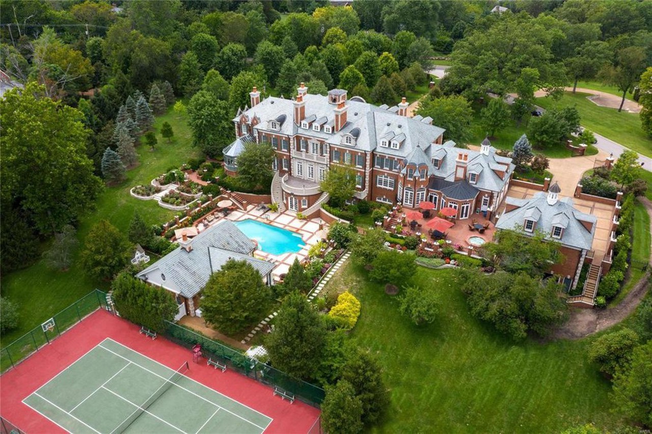 20 Upper Warson Rd, Saint Louis, MO 63124
$10,900,000
Locked away from the world behind two large gates is this six-bedroom beauty. Designed in an elegant fashion, this traditional-style house has all of those old-money amenitities like terraces, formal gardens, a Koi pond and a tennis court.
Visit the listing page here.
Photo credit: Realtor.com