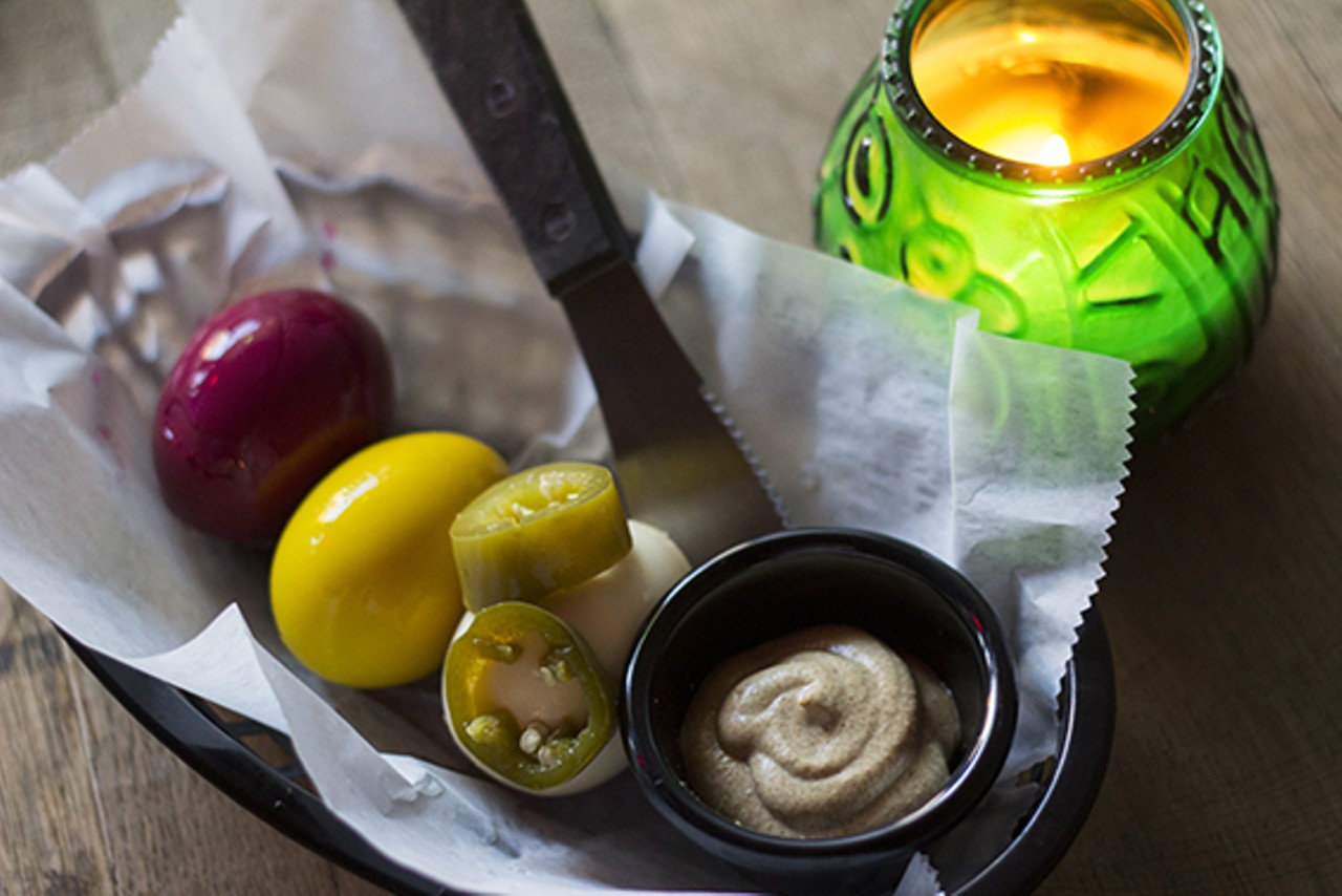 A housemade pickled-egg basket: beet, curry and jalapeno.