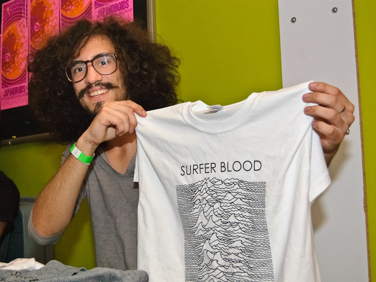 Surfer Blood member Marcos Marchesani shows off some of his band&rsquo;s merch.