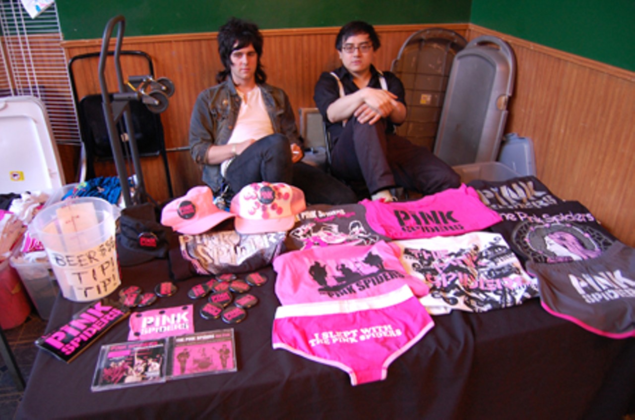 Two members of The Pink Spiders take a break before the show while fans pile into the Creepy Crawl.