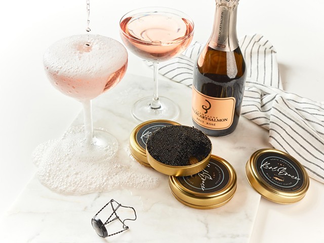 St. Louis-produced Karl Bruce caviar with champagne bottle and glasses of champagne.