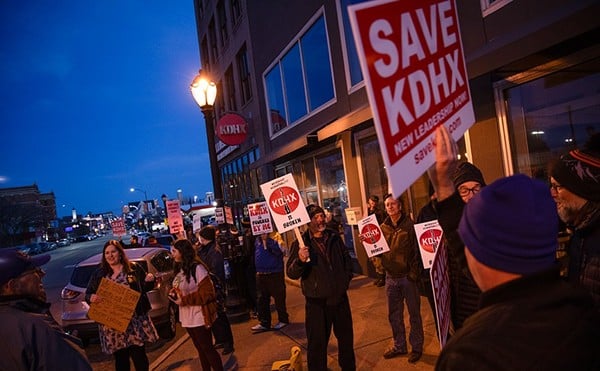 A group of protesters critical of KDHX's leadership pickets outside of the station's headquarters during last week's Associates Meeting.