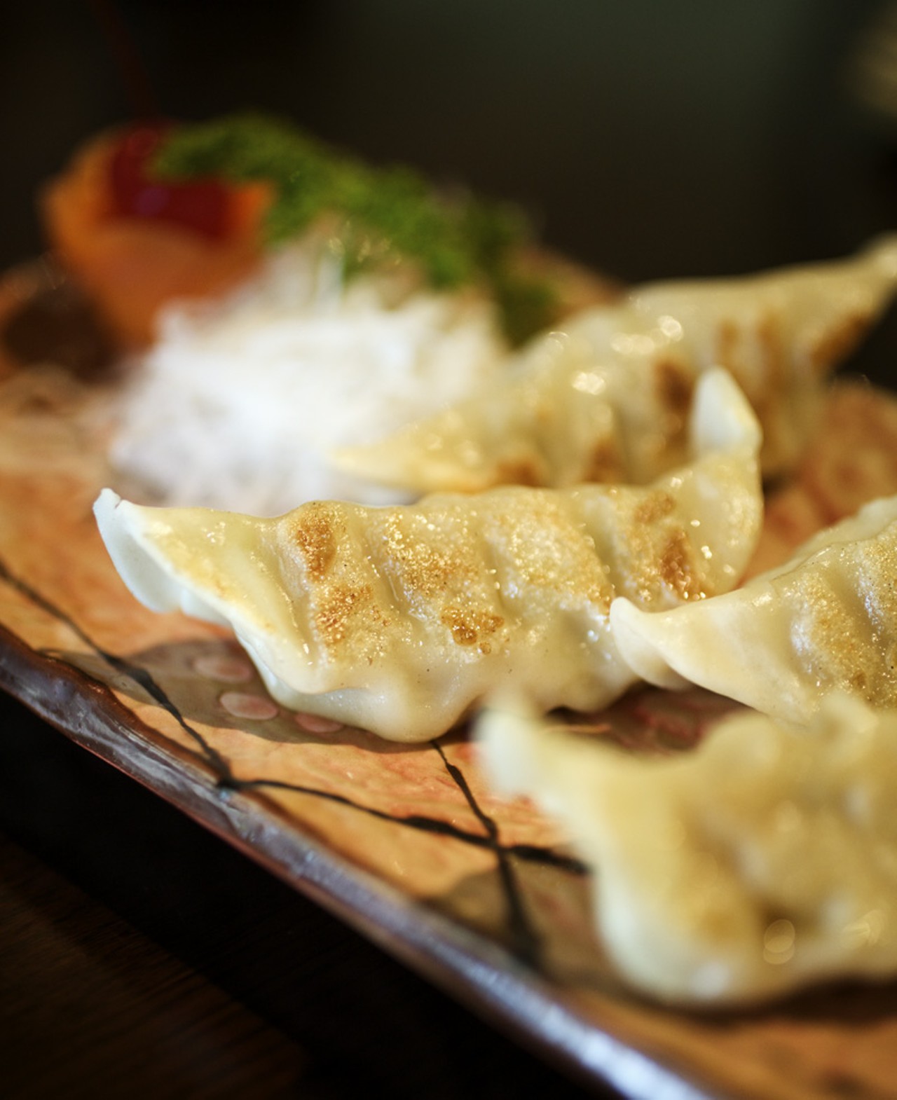 The Gyoza appetizer is a Japanese style pan-fried pot sticker made with pork.