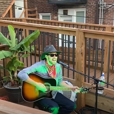 Justin Jagler playing on The Attic's patio