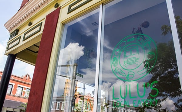 Window of Lulu's Local Eatery that shows restaurant's logo.