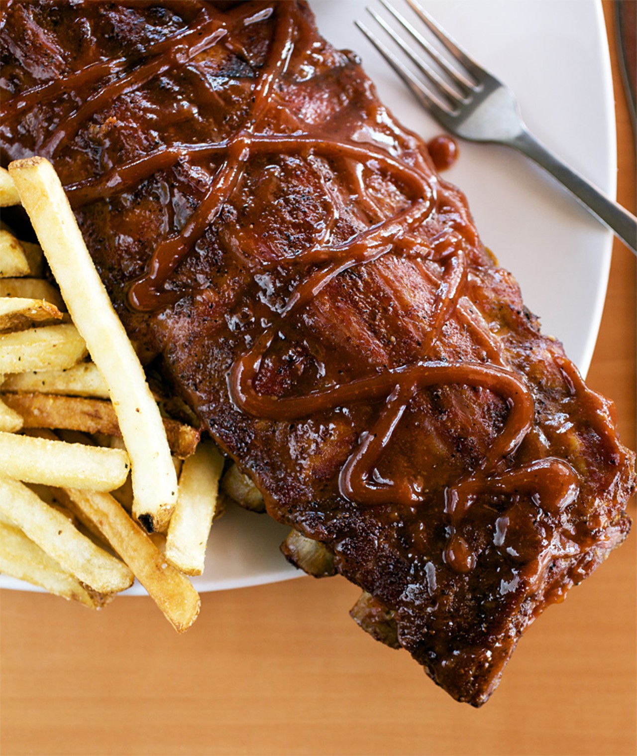 The BBQ ribs, cooked low and slow comes served with fries and coleslaw. They recommend pairing your ribs with their Pecan Brown Ale.