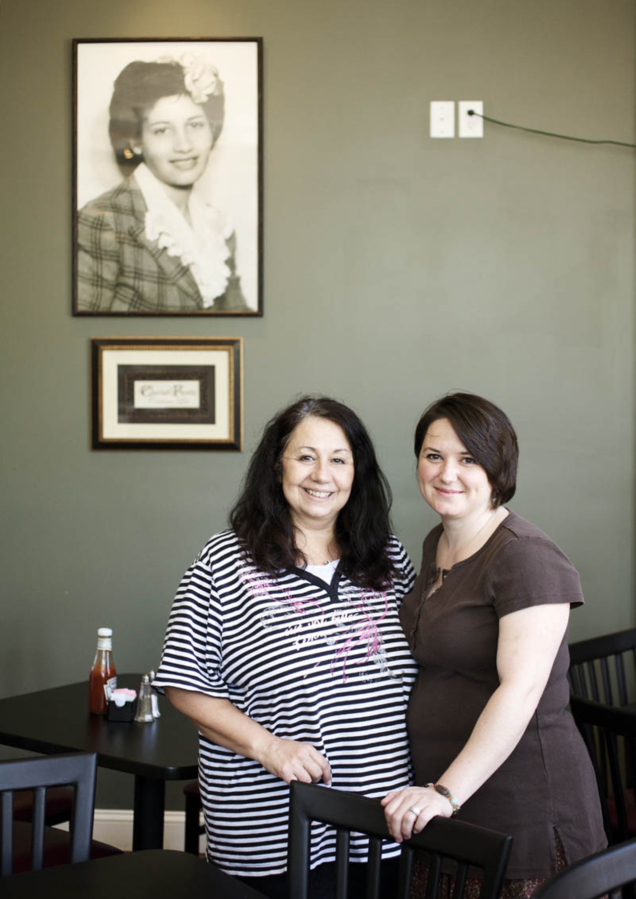 Mary Samuelson (left) and daughter Amy Keller (right) posing in the restaurant's interior below a portrait of Mary's mother and restaurant namesake, Josephine.