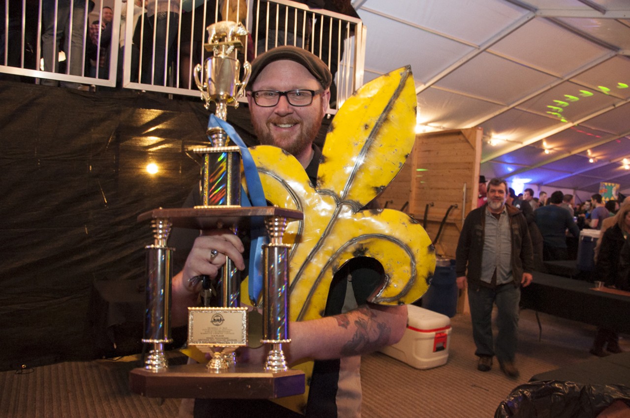 Casey from Sugarfire Smokehouse showing its trophies some love.